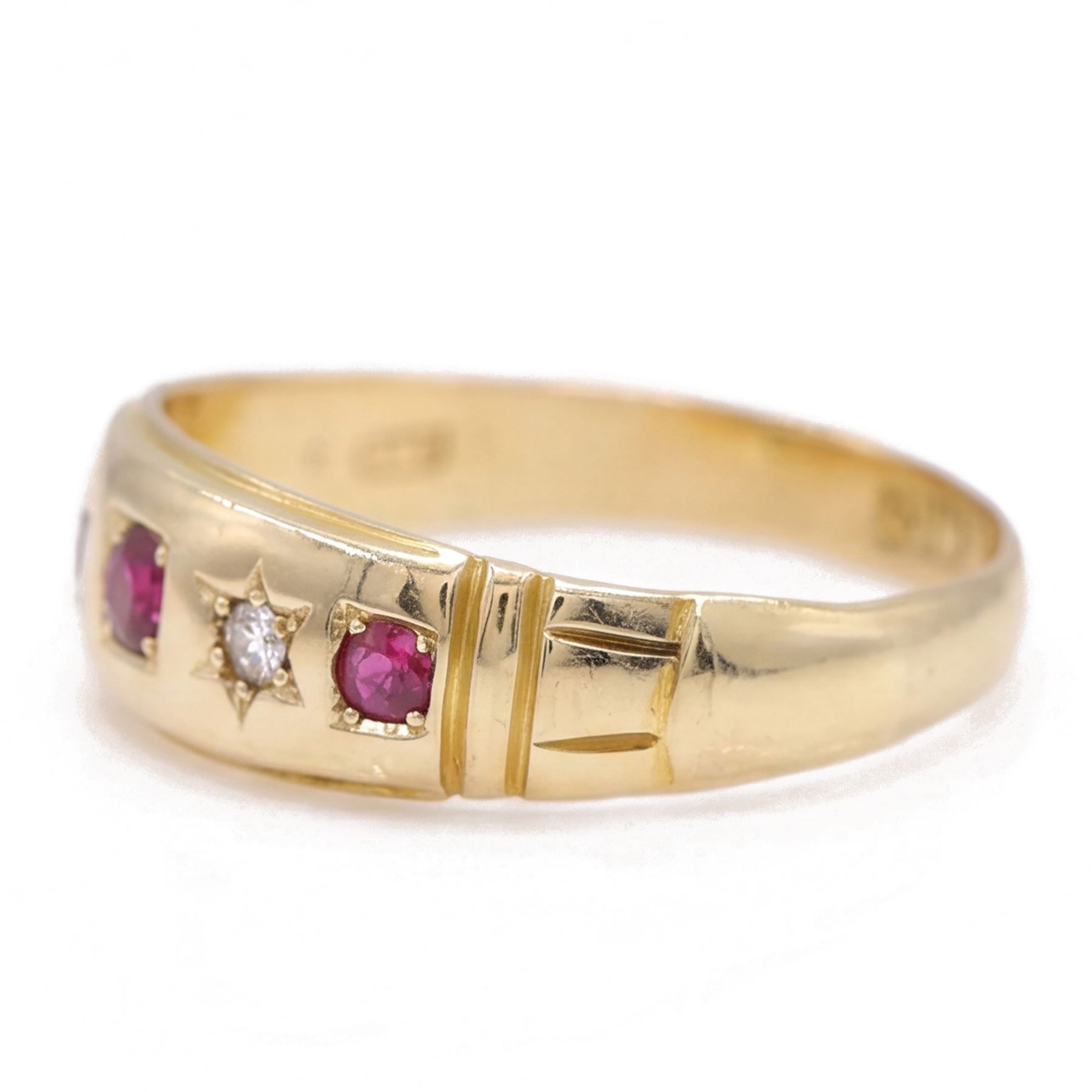 Victorian gold ruby and diamond gypsy ring, three round cut rubies spaced by two star set round cut diamonds, stamped 18ct