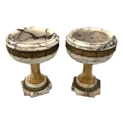 Pair of Neo Classical veined white marble urns, decorated with a metal band of classical drapes, raised upon a pedestal foot, H23cm