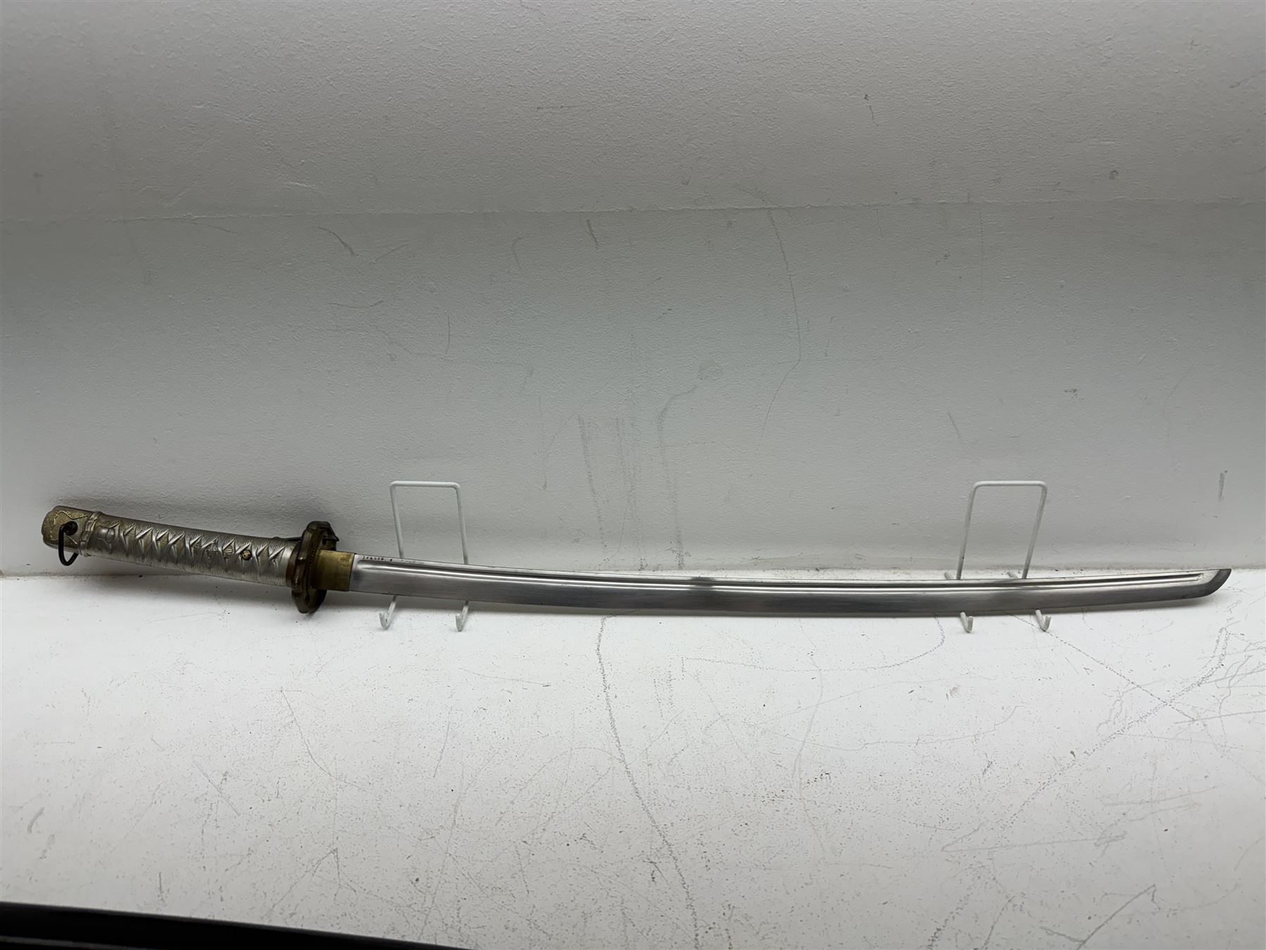 WWII Japanese katana with cast pierced tsuba, the L69cm arsenal steal blade marked 144559, with black lacquer Saya (scabbard), L97cm overall