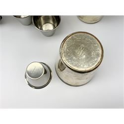 A silver plated set of four stirrup cuts with gilded interiors, by P H Vogel & Co, in brown leather case tooled in gilt J.R.S., each cup marked beneath P.H.V&Co Silver Plated Made in England, H8.5cm D7.5cm, together with a set of six stainless steel Swedish stirrup cups by Rostfritt, in green leather holder, each cup marked beneath Rosfritt, H4.5cm D5cm.