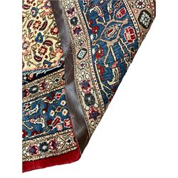 Persian Moud carpet, the field decorated all-over with Herati motifs, central medallion and spandrels decorated with stylised plant and flower head motifs, repeating border with guard