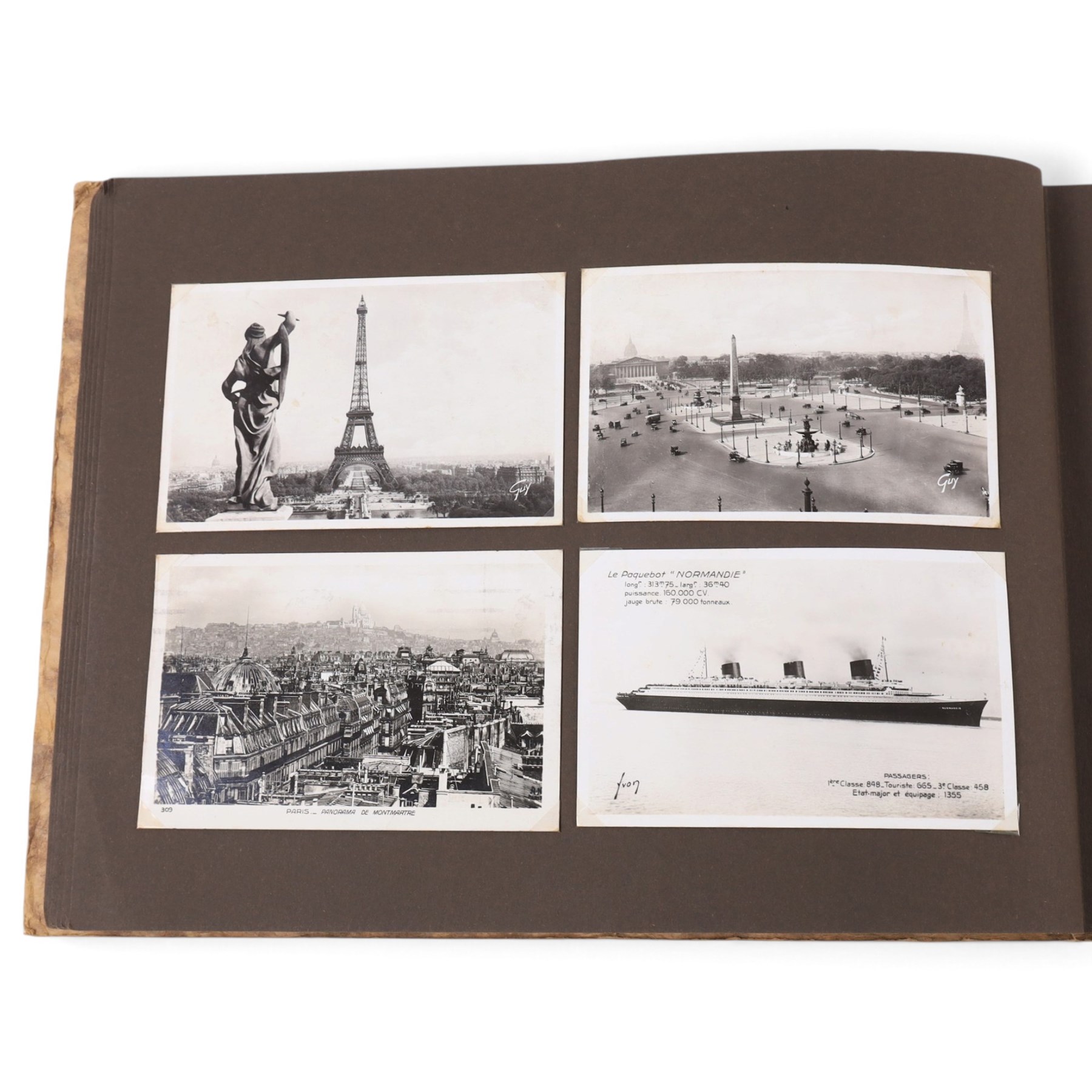 Two early to mid 20th century postcard albums, containing black and white and colour postcards of France, Turkey and Egypt, together with some personal photographs and newspaper clippings