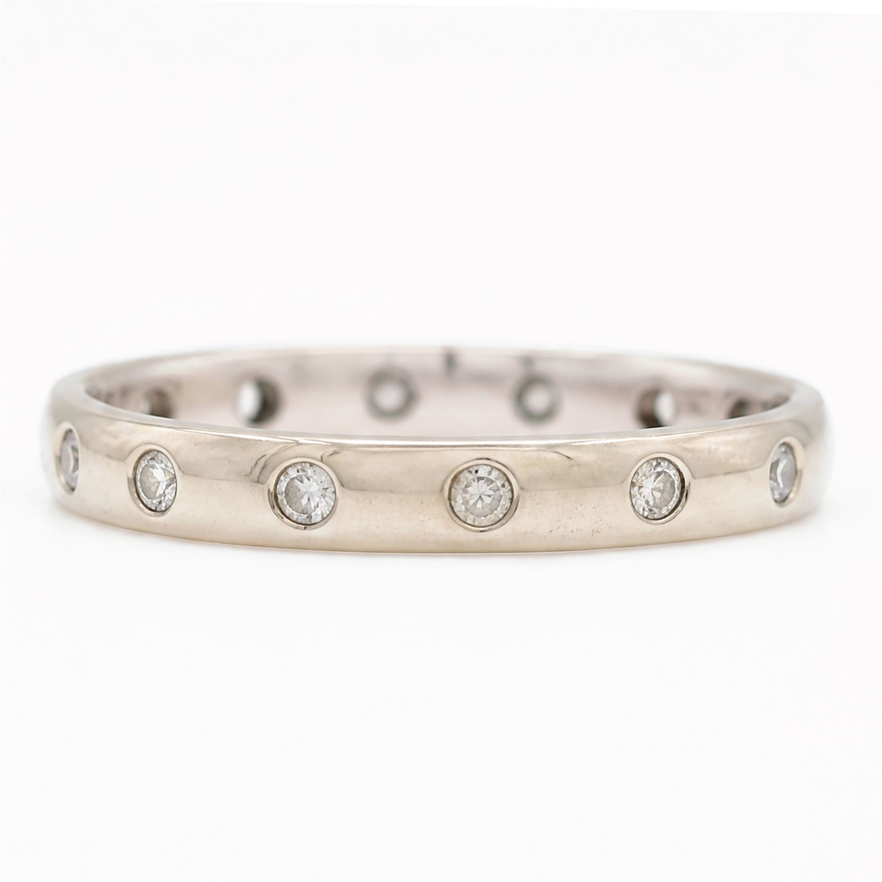 9ct white gold diamond wedding band, rubover set with fourteen round brilliant cut diamonds, hallmarked