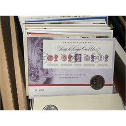 Approximately one hundred and fifteen Royal Mint coin covers, in two ring binder folders and loose, together with approximately 53 grams of Great British pre-1920 and approximately 68 grams of Great British pre-1947 silver threepence coins, and a small quantity of further pre-decimal coins