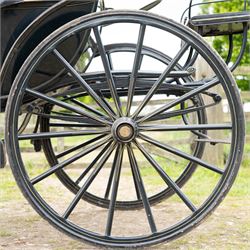George IV Phaeton Carriage by Mills, Paddington, London

A George IV four wheeled phaeton carriage by Mills, Paddington, London, the hubs stamped accordingly, with black painted bodywork, folding black leather hood, upholstered passenger compartment and rear luggage platform. The carriage is fitted with wooden spoked wheels, yellow coachlining, leaf spring suspension, front mudguards, metal footrests and shafts for single horse use. In original condition by one of the best carriage builders of the day

Features

• Maker’s hubs marked Mills, Paddington, London
• Four wheeled phaeton carriage
• Black painted bodywork with fine yellow coachlining
• Folding black leather hood
• Button upholstered passenger seating
• Rear luggage platform with rail
• Wooden spoked wheels with rubber tyres
• Leaf spring suspension
• Shafts for single horse use
• Front mudguards and metal footrests
• Fitted with a side mounted ratchet hand brake operating on the rear wheel


Dimensions:
Overall length: 305 cm
Width: 160 cm
Height: 213 cm

Wheel Diameters:
Front wheels: 77 cm
Rear wheels: 107 cm

Seating:
Driving seats: 1
Passenger seats: 2