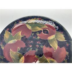 Moorcroft charger decorated in Pomegranate pattern, circa 1918, with painted and impressed marks beneath, D22cm