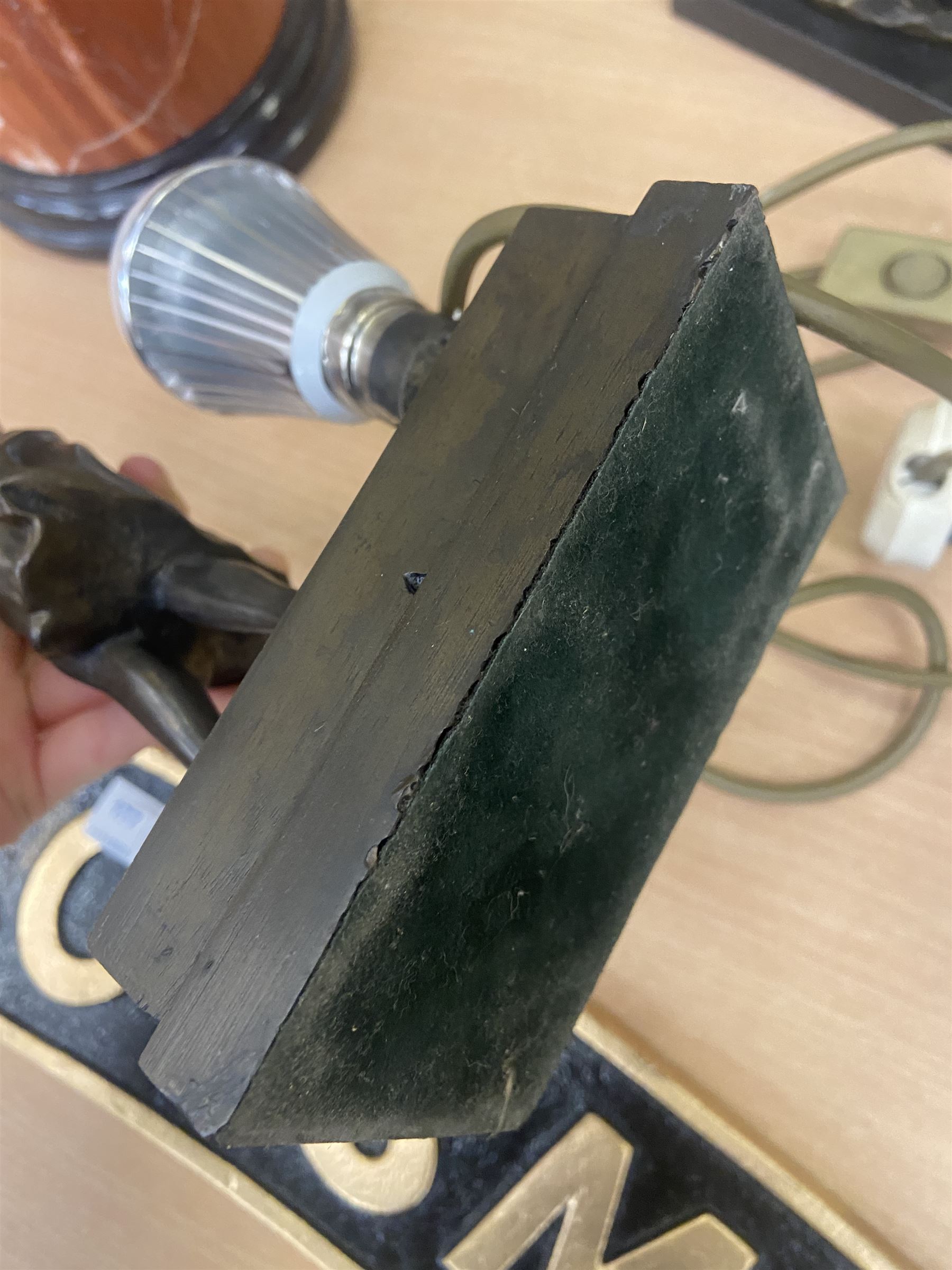 Art Deco style table lamp, modelled in the form of a bronzed female figure before a leaded glass fan shaped shade, H38cm