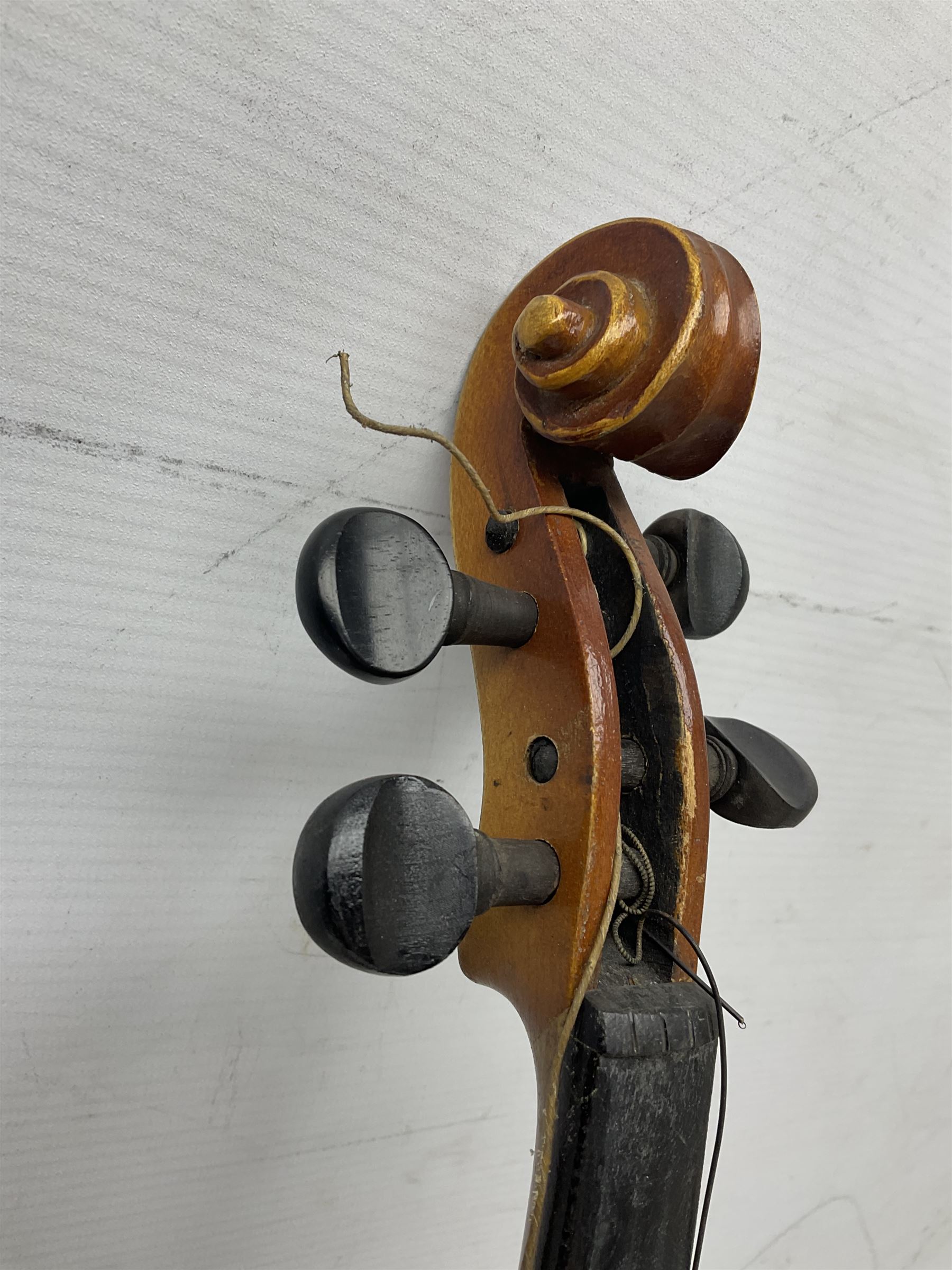Czechoslovakian violin c1920 with 36cm two-piece maple back and ribs and spruce top, bears label 'Copy of Antonius Stradivarius Made in Czechoslovakia' L59cm; in carrying case; 1950s Czechoslovakian violin; and 195os Czechoslovakian three-quarter size violin; both cased (3)