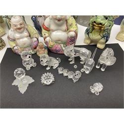 Set of three graduating foo dogs, together with a collection of Swarovski Crystal figure and other collectables 
