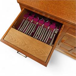 Seahorseman by Shaw & Riley - Yorkshire oak Welsh dresser, the dresser rack of rectilinear form with plain frieze and projecting moulded edge above two shelves with central shallow groove, the base section fitted with four drawers and a fitted cutlery drawer containing cutlery, above four panelled cupboard doors with geometric mouldings and carved sculpted handles, interior with single shelf and sides with geometric mouldings raised on a shallow plinth base with shaped bracket feet, with signature Seahorse carving from the workshop from the workshop of A. Shaw & Riley Ltd, Hessay