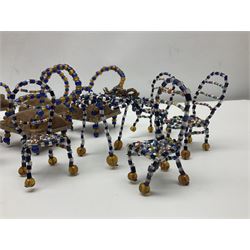 Quantity of early 20th century doll's house furniture comprising Victorian style beadwork and upholstered eight-piece salon suite; beadwork dining table with four matching chairs; and Kleeware brown plastic seven-piece dining suite