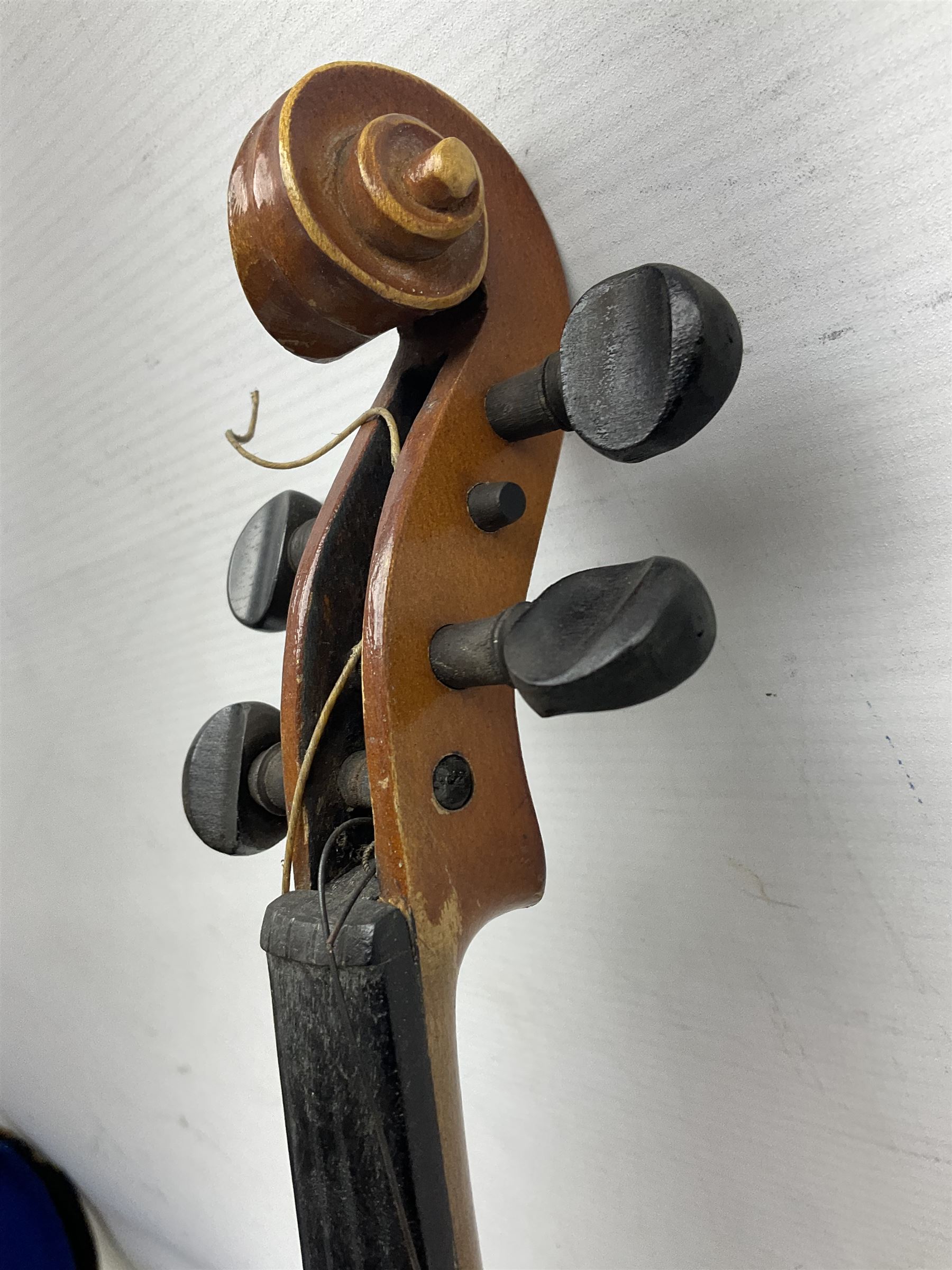 Czechoslovakian violin c1920 with 36cm two-piece maple back and ribs and spruce top, bears label 'Copy of Antonius Stradivarius Made in Czechoslovakia' L59cm; in carrying case; 1950s Czechoslovakian violin; and 195os Czechoslovakian three-quarter size violin; both cased (3)