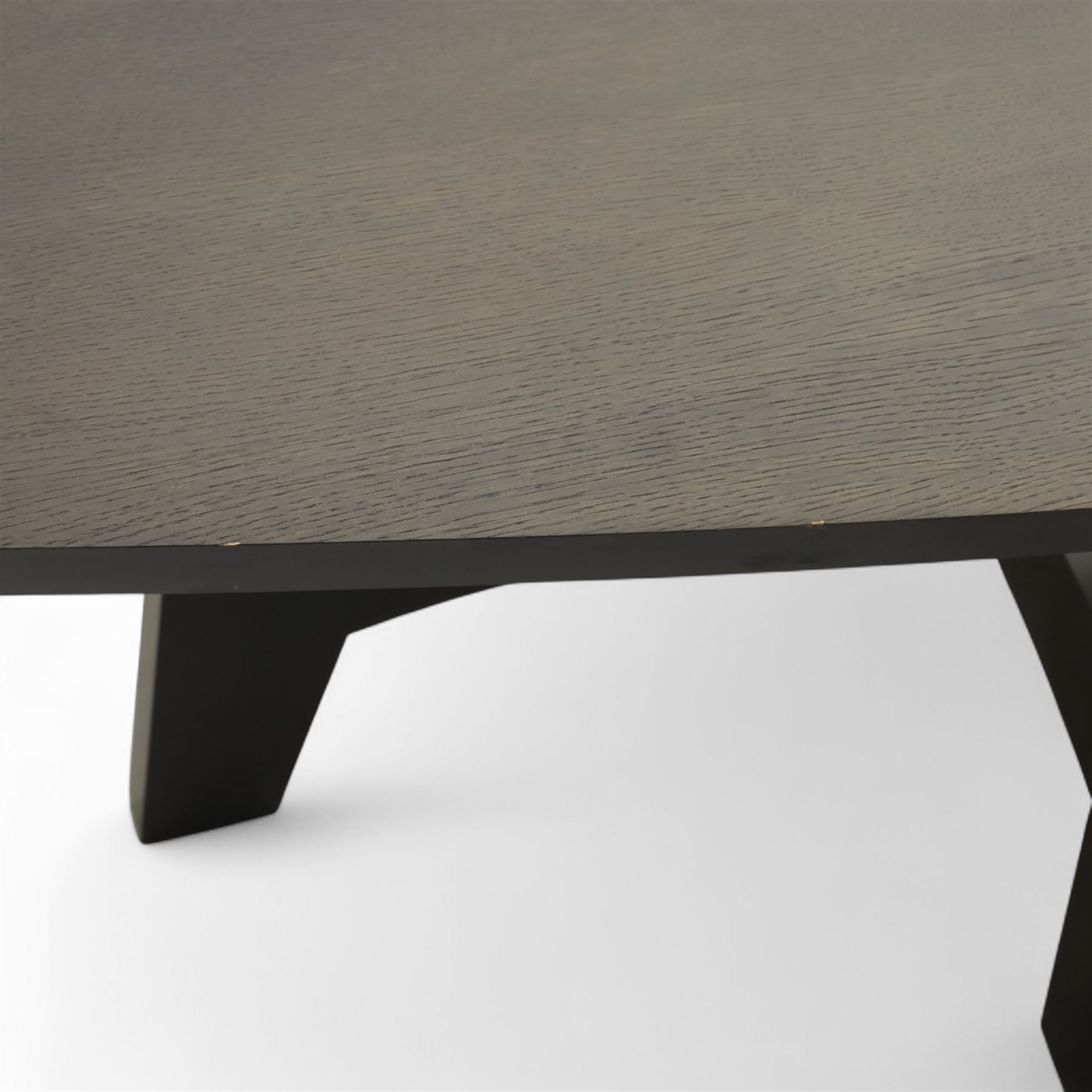 Contemporary black ash finish engineered wood hall table, with bow front top raised on a trestle style base 