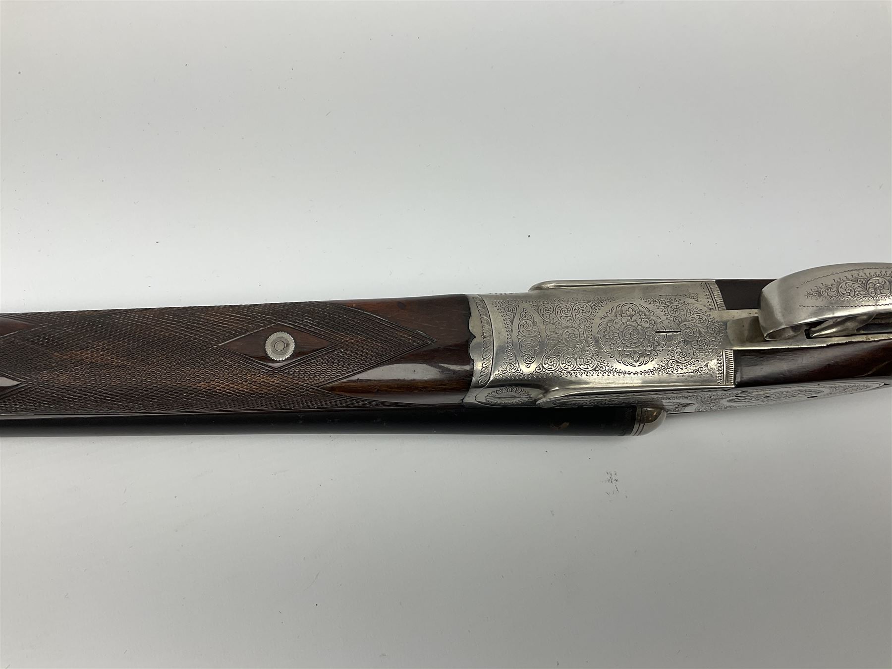 Gunmark Silver Sabel De Luxe 12-bore side by side double barrel side lock ejector sporting gun, 68.5cm barrels with 2.75cm chambers and matt bluing, walnut stock with chequered grip and fore-end and thumb safety, serial nos.12509 & 100.085, L111.5cm overall SHOTGUN CERTIFICATE REQUIRED