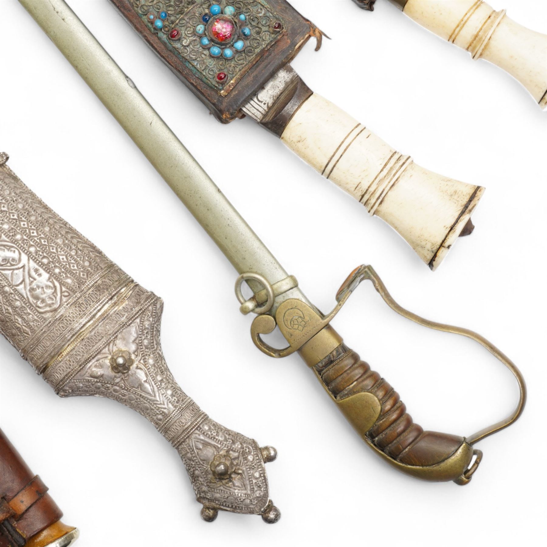 Gurkha Kukri with horn handle and jewelled scabbard, two other Kukris, Arab jambiya Finnish sporting knife with birch handle by Martiini Rovaniemi and German made WWI sword probably for the Turkish market