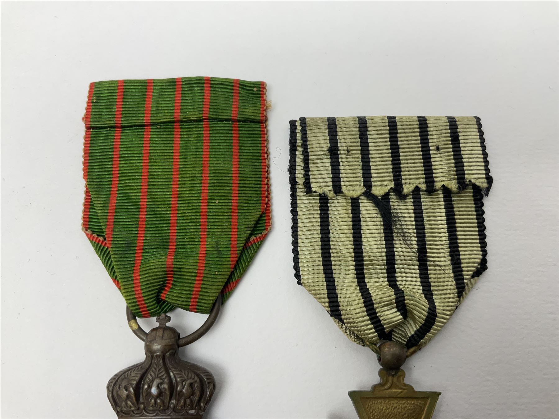 Four French medals - St. Helena medal with bust of Napoleon to obverse and inscription to reverse 'Campagnes de 1792 a 1815. A ses compagnons de gloire sa derniere pensée Ste. Hélène 5 Mai 1821', established by Emperor Napoleon III in 1857; two WW2 Croix-de-Guerre; and WW2 Croix-du-Combattant; all with ribbons (4)