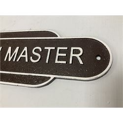 Cast iron Station Master wall plaque on a brown ground, L39cm