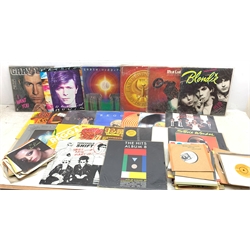 A collection of Vinyl records and singles, to include Stevie Wonder Hotter than July, Blondie Parallel Lines, Blondie Eat to the Beat, Meat Loaf Bat Out of Hell, Diana Ross Live, Bob Marley & The Wailers Coult You be Loved, David Bowie Fashion, Reggae Disco 45, Reggae Party Time Vol 2 Blooblo, etc. 