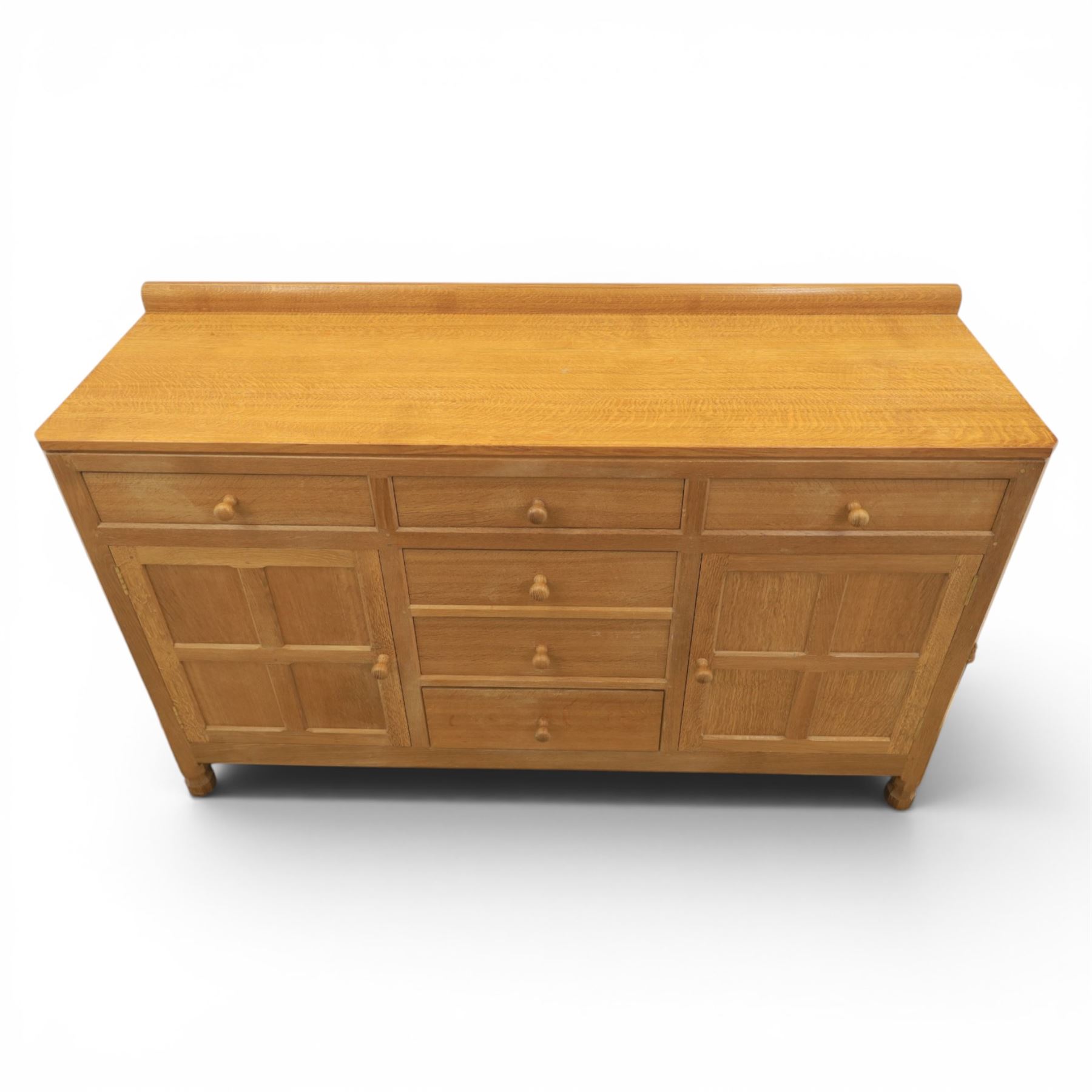 Mouseman - adzed oak dresser, fitted with six drawer and two cupboards, with carved mouse signature, by the workshop of Robert Thompson of Kilburn