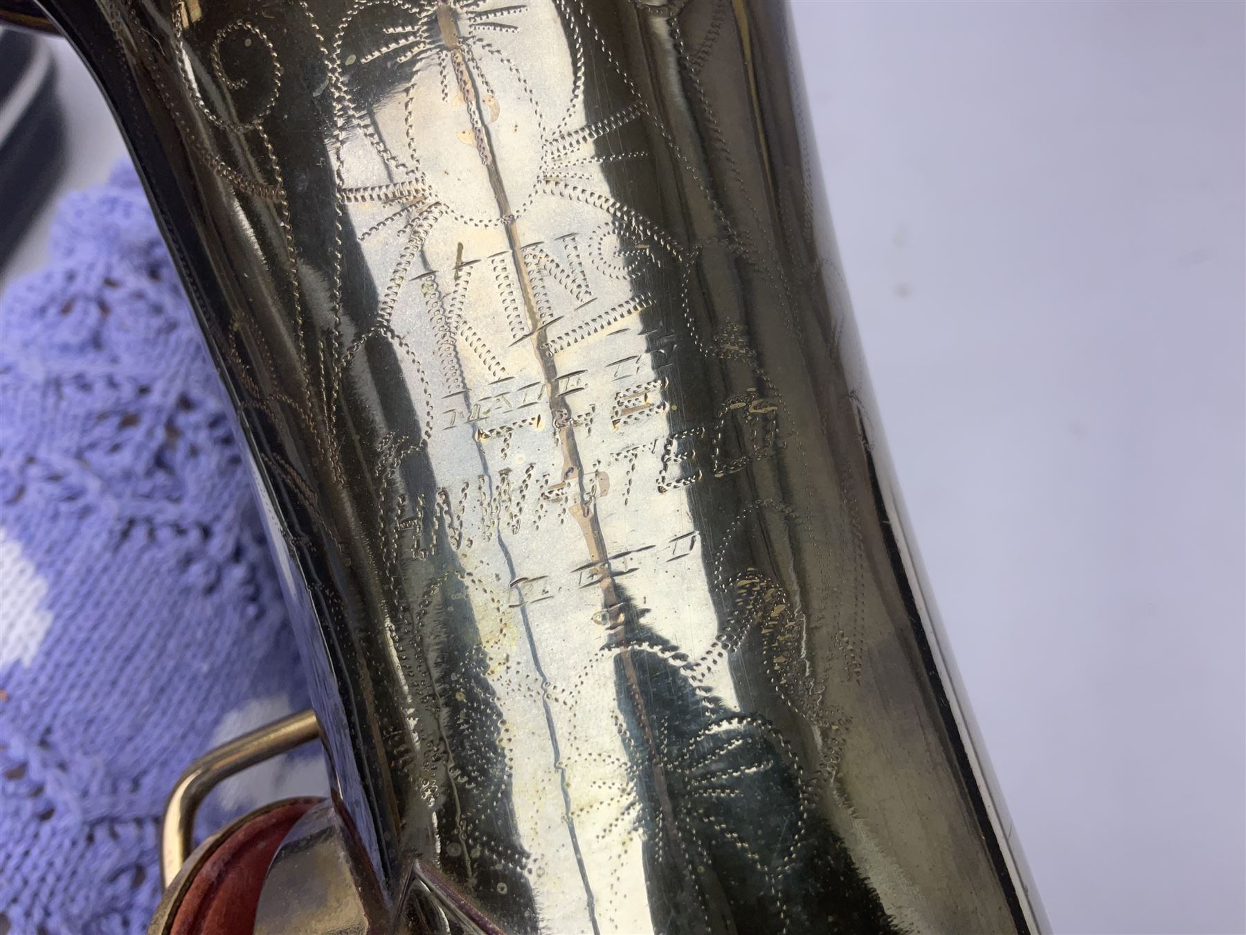 Lacquered brass 'King' alto saxophone inscribed Made by the H.N. White Co.' (Cleveland Ohio) with crook, serial no.84128; also stamped No.1 549 911 and Pat D 8-18-25; in fitted carrying case 