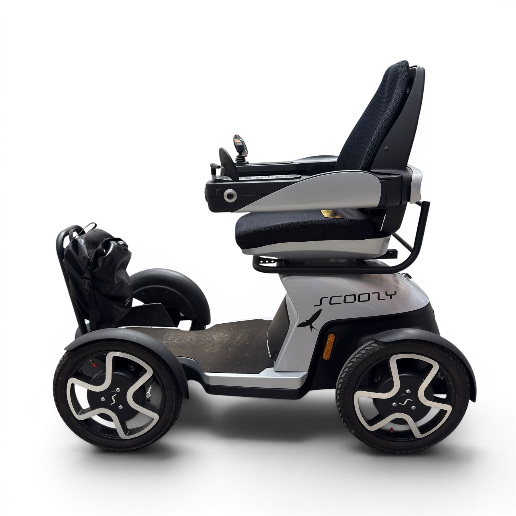 TGA Scoozy - mobility scooter, four wheel model with joystick controls, front storage bag, lights and grey and black bodywork.
