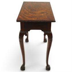 George I carved mahogany side table, adapted from a card table, the rectangular top with foliate-carved edge above a plain frieze, raised on cabriole legs with acanthus-carved knees, volute brackets and floral-carved motifs, terminating to ball-and-claw feet
