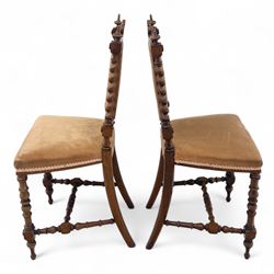 Pair of 19th century oak hall chairs, shield form backs with carved scroll cresting and finial uprights, upholstered in tan velvet, on turned and block supports joined by stretcher rails