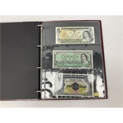 Album containing various world banknotes