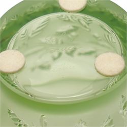 Lalique green glass tea light holder decorated with the coriandre pattern H8cm, another in the basil pattern H8cm and another with trailing leaves H8cm, all signed 'Lalique, France'