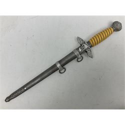 WW2 German Luftwaffe 2nd Pattern Officers dress dagger, with unmarked 25.5cm double edged steel blade, wire-bound pale orange/yellow celluloid grip, globular  pommel with oak leaves and traces of gilding, Luftwaffe eagle cross guard; in beaded scabbard with two suspension rings L43cm overall