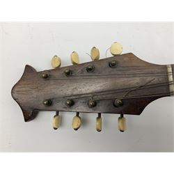 Italian mandolin, with foliate inlaid scratchplate, paper label inscribed 'Carlo Loveri & Figlio of Napoli', L62cm
