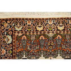 Indian silk-inlaid prayer rug, ivory field decorated with a triple-arched Mirab motif, pendant medallion, paired birds and flowering vases, enclosed by a black ground guard band of scrolling foliage and palmettes