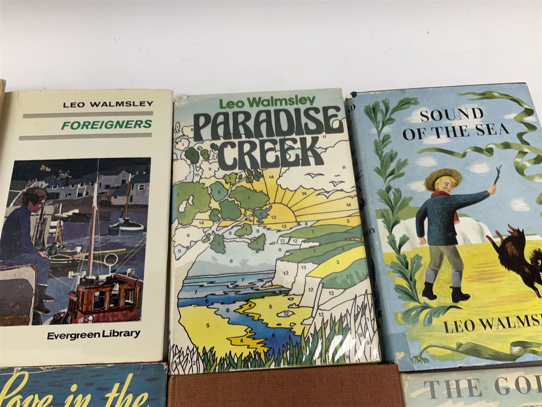 Leo Walmsley: a collection of Novels mostly 1st ed. including Phantom Lobster, signed by the author, Love in the Sun, The Happy Ending, Angler's Moon, Sally Lunn, The Silver Blimp, Love in the Sun, Paradise Creek, Fishermen at War, Golden Waterwheel, Sound of the Sea, etc (16)
