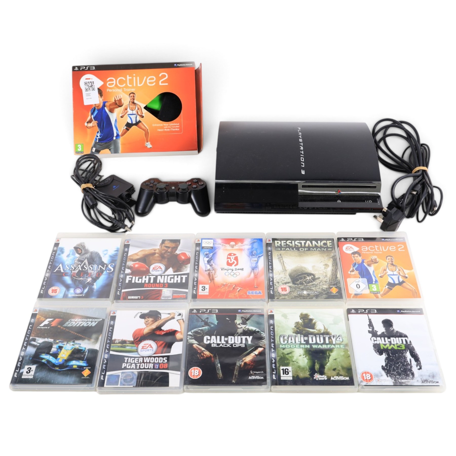 Playstation 3 console with controller and power cable and ten games, comprising EA Sports Active 2 Personal Trainer, F1 Championship Edition, Tiger Woods PGA Tour 08, Call of Duty Black Ops, Call of Duty Modern Warfare, Call of Duty MW3, Resistance Fall of Man, Assassin's Creed, Fight Night Round 3, Beijing 2008