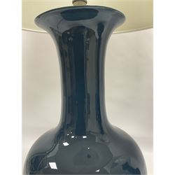 Pair of Chinese teal glazed table lamps, each of bottle form, raised upon circular hardwood bases, including shade H72cm 