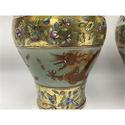 Pair of early 20th century Chinese vases decorated with dragons chasing a flaming pearl, with a gilt border of butterflies and floral sprigs, with Elephant head handles, H44cm 