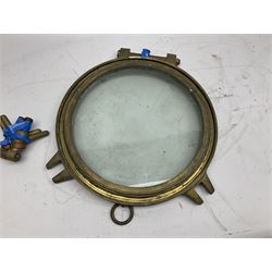 Four ship's large glazed brass portholes, two with opening facility; largest D38cm; and a ship's glazed brass hinged porthole opening cover (5)