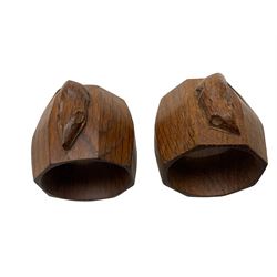Mouseman - pair of oak napkin rings, of bulbous octagonal form each carved with mouse signature, by the workshop of Robert Thompson, Kilburn, L5cm 
 W7cm