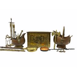 A brass coal box, embossed to top and front with figures looking through a window, H29.5, together with a coal scoop, two coal buckets, and other fireside accessories. 