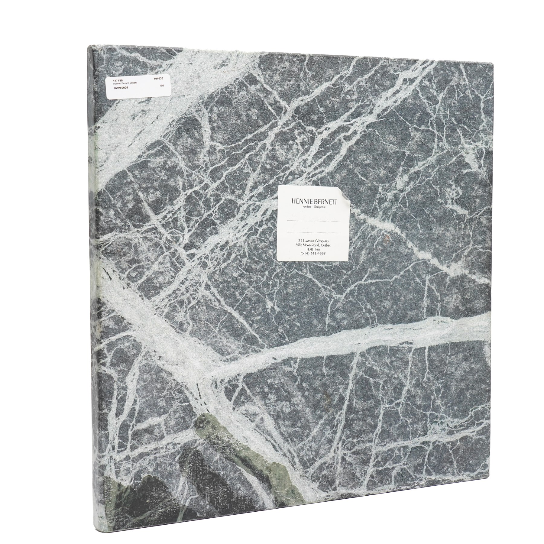 Hennie Bernett (20th/21st century): Inuit mother carrying her child in an amauti, bas-relief in verde marble, signed 'Hennie Bernett' with sculptor's sticker on the rear, 38.2cm x 38cm 