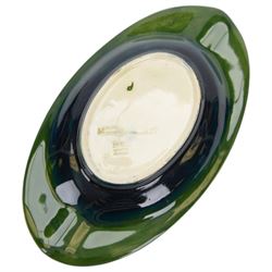 Two Moorcroft ashtrays in Magnolia pattern and Anemone pattern, together with pin dish in anemone pattern  