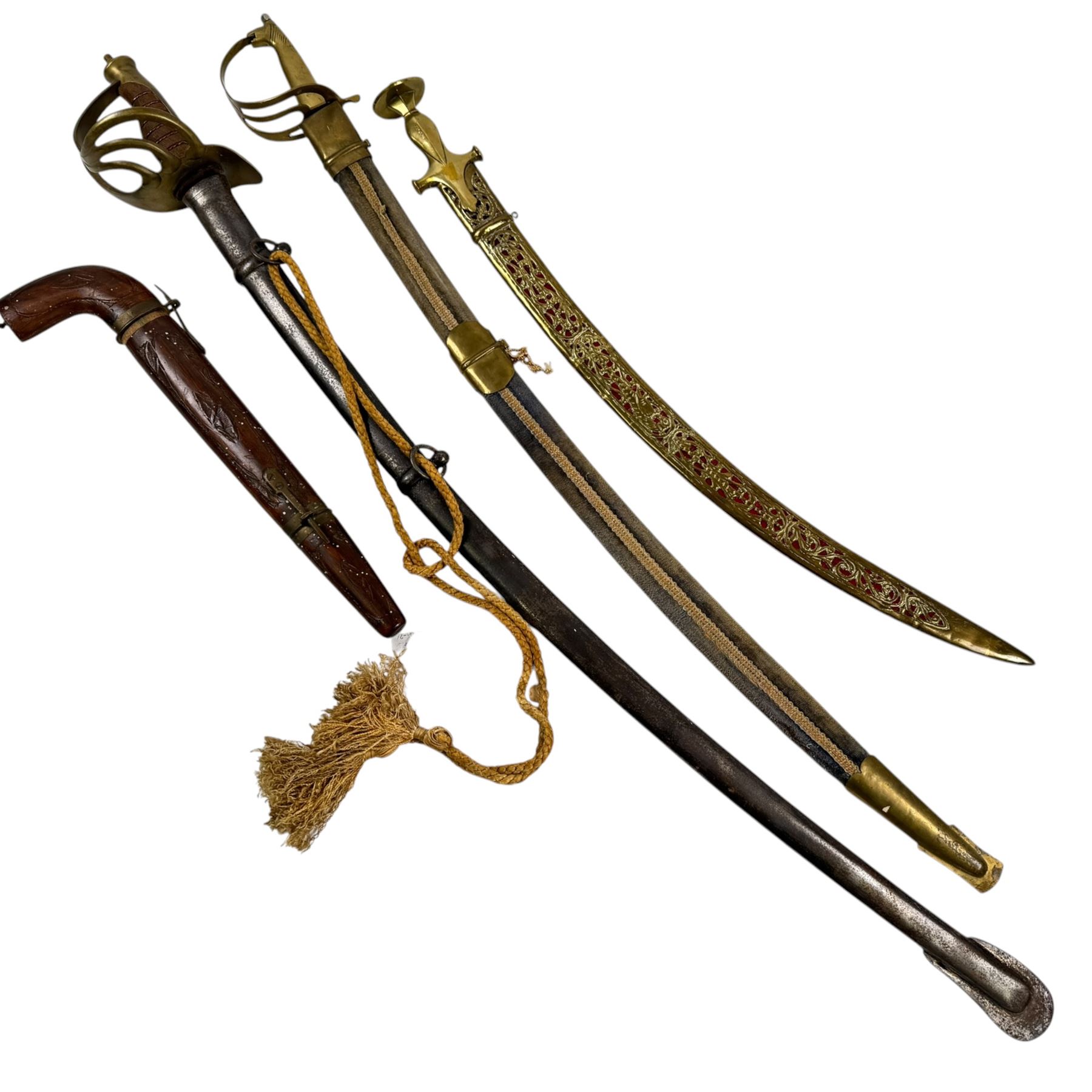Three Indian swords, including Ceremonial Tulwar style sword with pierced decoration to brass scabbard, etc 