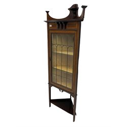 Edwardian inlaid mahogany corner cabinet, fitted with single astragal glazed door enclosing two shelves, flanked by satinwood banding, on square tapering supports united by undertier
