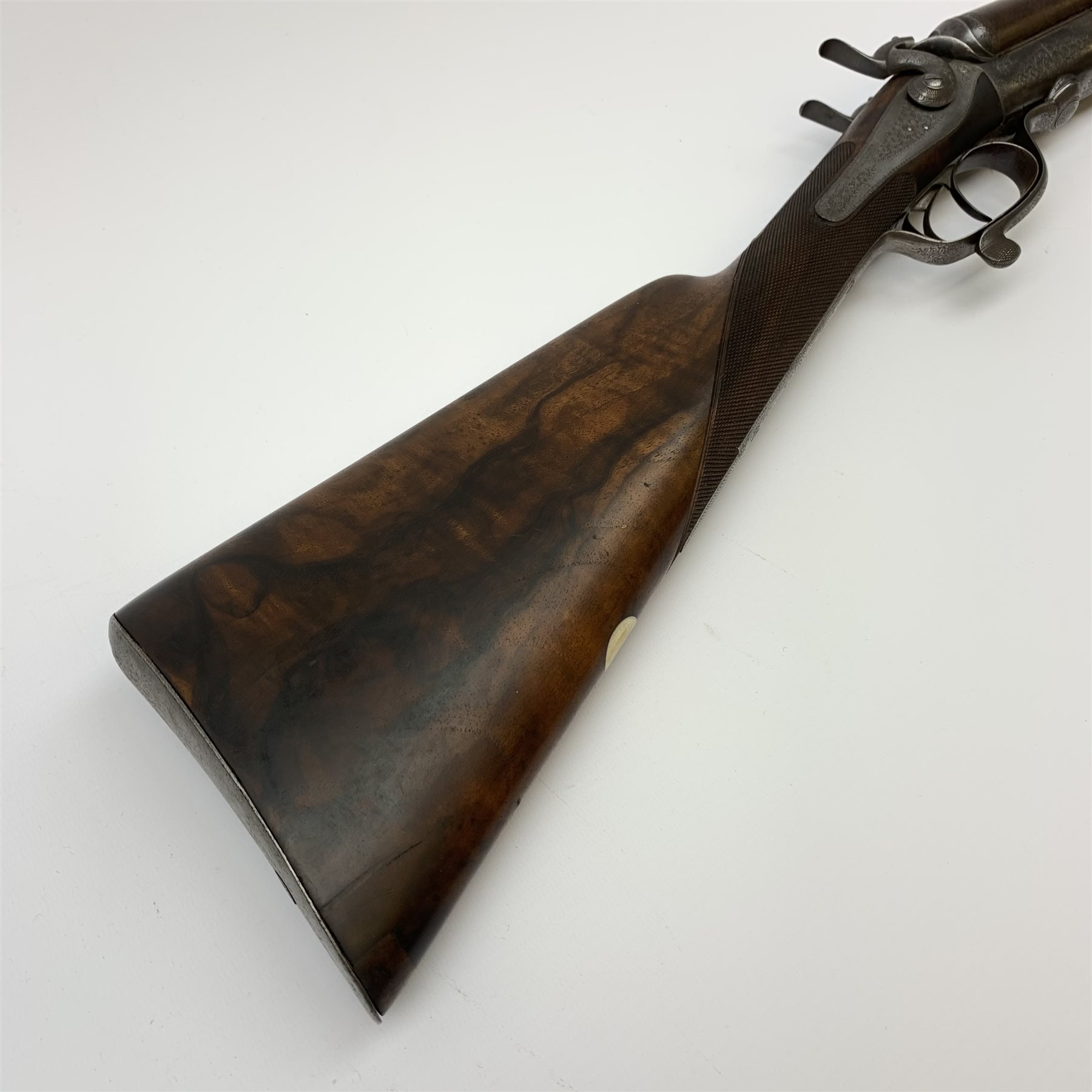 19th century James Woodward 64 St. James's Street London 12-bore side-by-side double barrel hammer shotgun with screw under lever opening and patent action, walnut stock with chequered grip and 76cm damascus barrels, No.3186, L117cm overall SHOTGUN CERTIFICATE REQUIRED