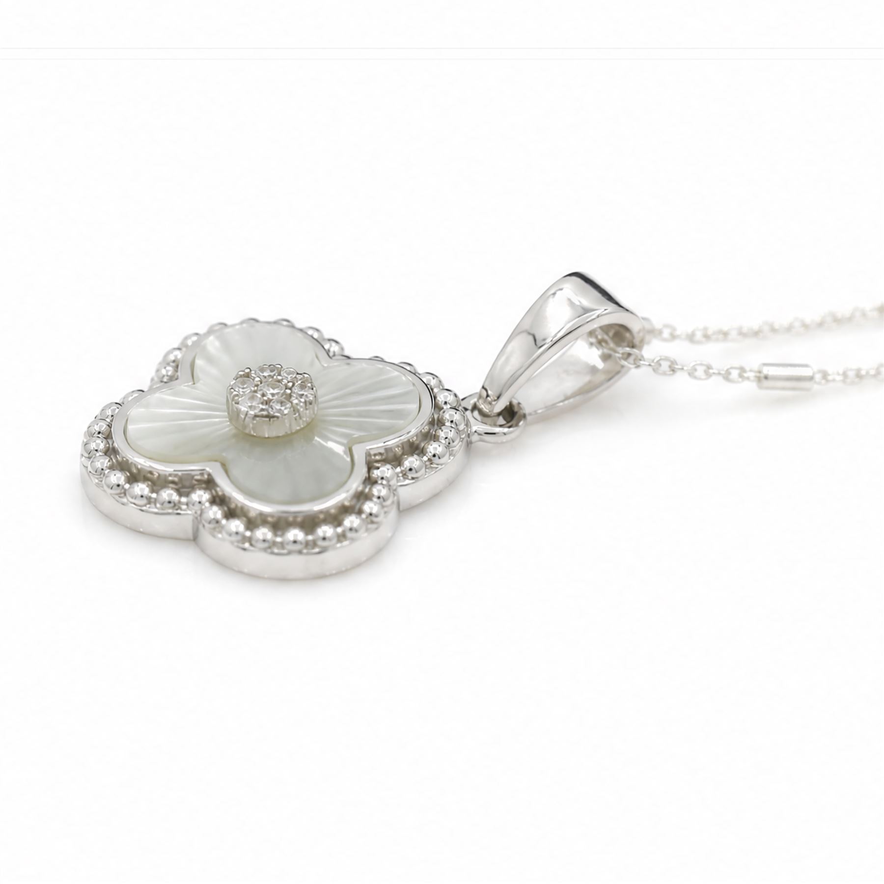 Silver cubic zirconia and mother of pearl flower head pendant necklace, stamped 925