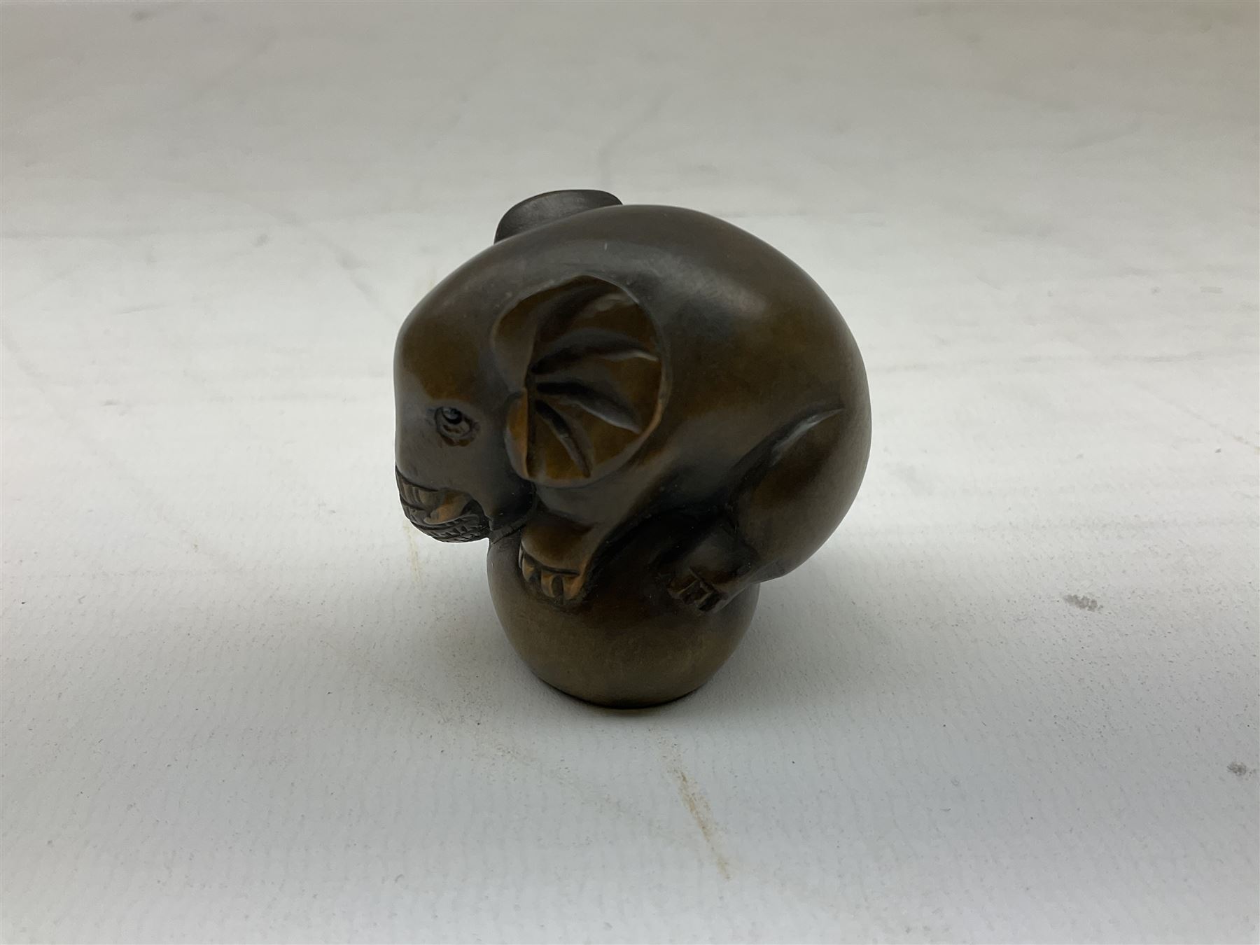 Netsuke in the form of an elephant, signed to base