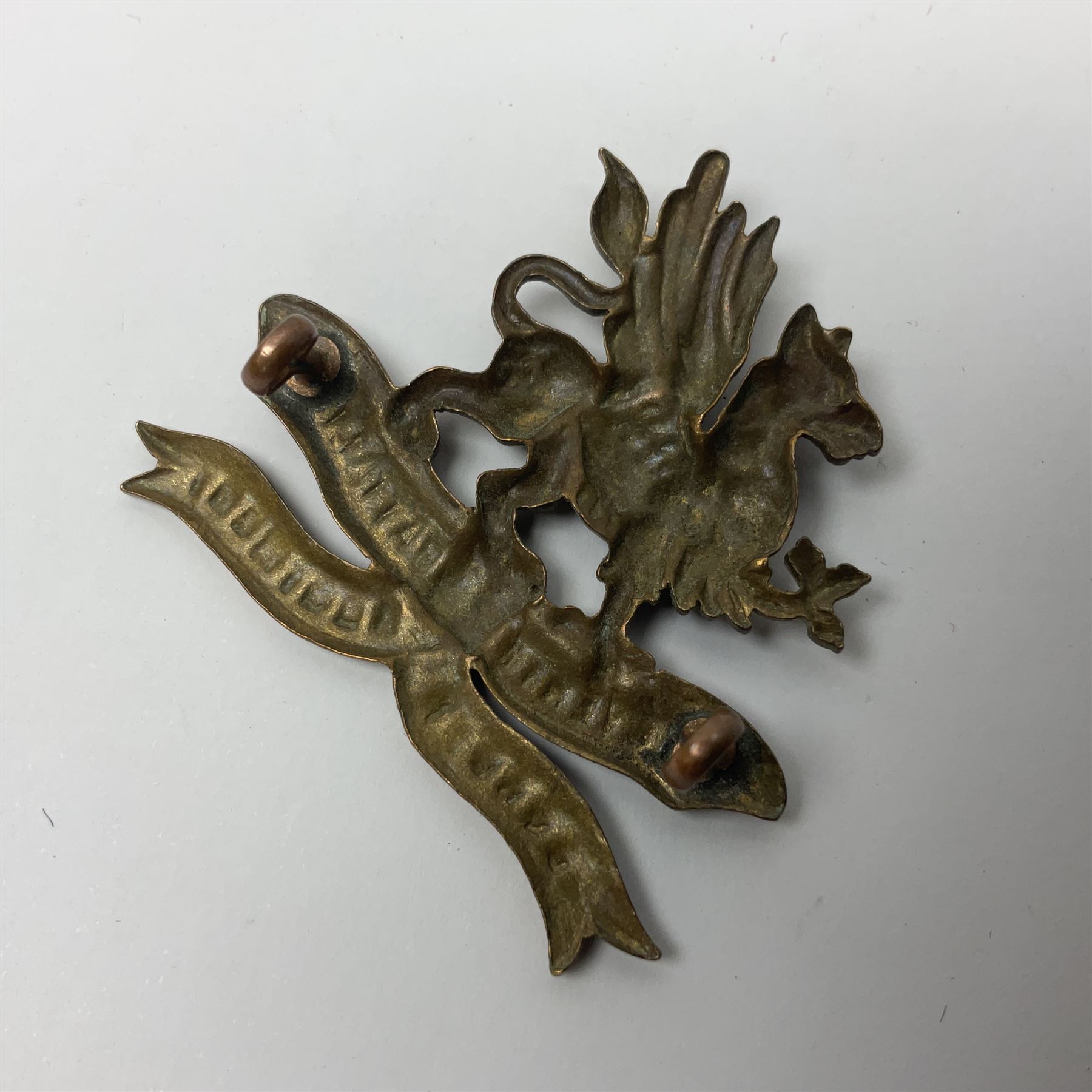 Four Border Regiment cap badges including eleventh battalion (4)