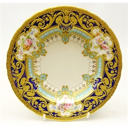  Royal Crown Derby dessert bowl from the Judge Elbert Henry Gary service, circa 1909, hand painted by Albert Gregory with baskets of flowers in cartouche shaped panels on cobalt blue and turquoise ground with raised gilded border incorporating an oval medallion with the initial 'G' by George Darlington, signed A. Gregory and G.W. Darlington, printed backstamp in gilt with Royal Warrant and Tiffany & Co retailer's mark, D21cm. Provenance Property of Bob Heath, Brandesburton Formerly of Ravenfield Hall Farm near Rotherham  