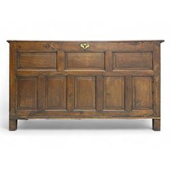 18th century oak coffer, the rectangular top above a eight-panel front with moulded framin...