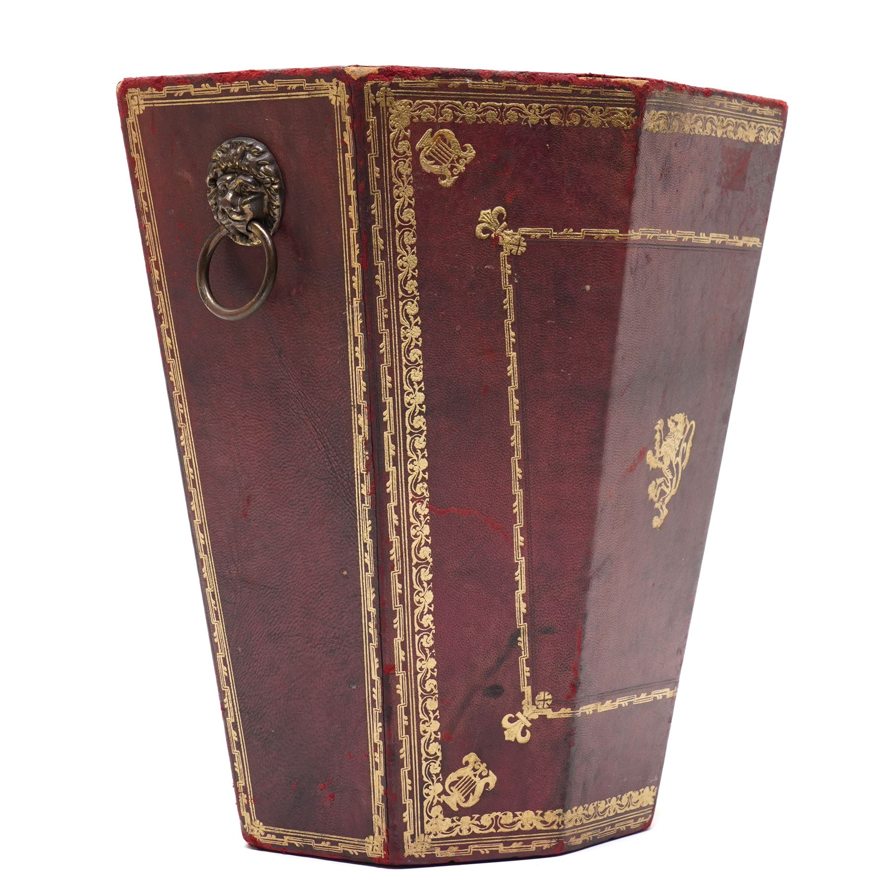 Regency style burgundy leather waste paper bucket of tapering octagonal form with gilt-tooled borders, sides fitted with lion mask ring handles, interior lined with marbled paper, circa 1900